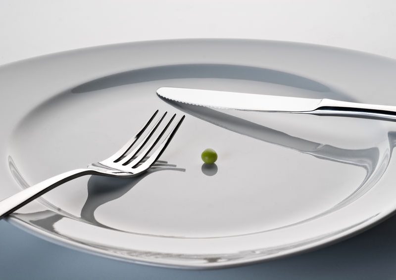 Plate With Cutlery And A Pea